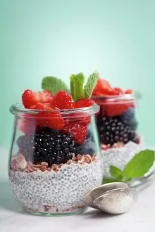 Wellness Prints: Chia seeds vanilla pudding and berries on blue background - Healthy food