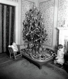 Christmas Tree Prints: Chidlren in front of Christmas tree ca. 1910-1935