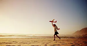 Adventure Prints: Child, beach and playing with airplane toy for flying game
