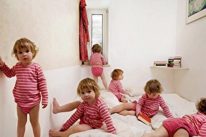 Surveillance Prints: Child crawls across bed
