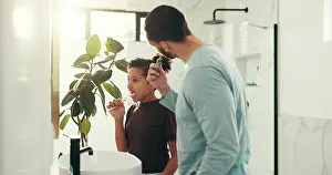 Cleaning Prints: Child, dad and brushing teeth in bathroom for dental hygiene or morning routine together in home