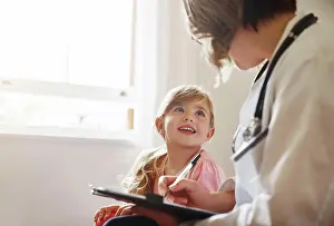 Advice Prints: Child doctor, girl and talking trust with medical checklist in a hospital for wellness and health