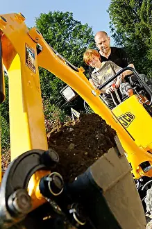 Fair Skinned Prints: Child with his father on a mini digger
