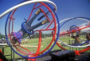 Futuristic Prints: Child playing on The Circulator, futuristic playground equipment, Pasadena, California