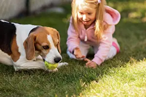 People In Nature Prints: Child playing with dog on grass