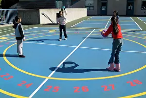 Model Release Prints: Children, age 11, playing a numbers game with a ball, San Francisco, California