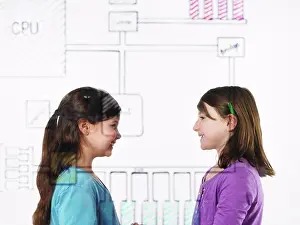 Point Of View Prints: Two children facing each other behind a drawing of a computer motherboard circuit drawn on a see through clear surface