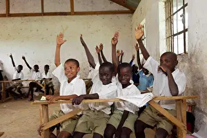 Works Prints: Children with hands up in classroom at rural school, Kenya, June