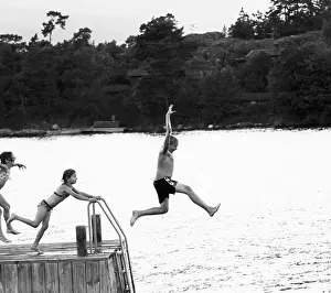 Summers Prints: Three children jumping from a jetty, Sweden