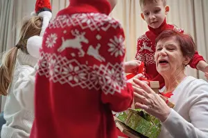 Grandma Prints: children receive gifts from grandmother