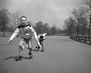 Skilled Prints: Children roller skating in park
