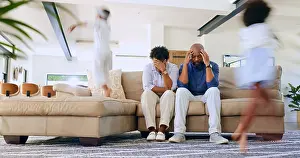 Migraine Prints: Children running and parents on sofa with stress