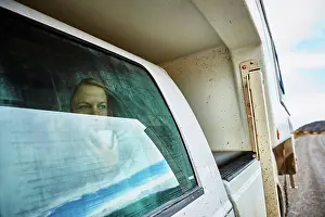 Glass Material Prints: Chile, Valle Chacabuco, Parque Nacional Patagonia, woman looking out of window in camper