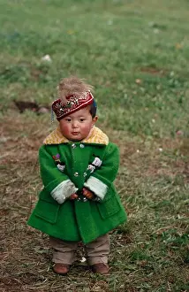 Solitary Prints: China, Children, Portrait Of Young Kazakh Child Wearing Green Wool Coat And Embroidered Cap