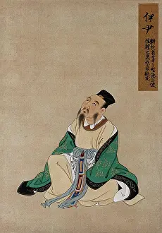 Emerald Prints: A Chinese figure, seated, wearing emerald green coloured silk robes with a black