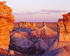Arizona Prints: Chinle Formation badlands and hoodoos illuminated at sunset