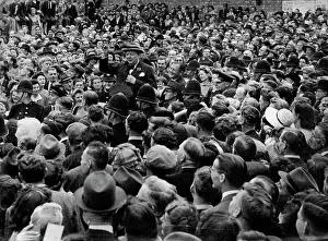 1945 Prints: Churchill Hailed On Election Tour -- The Prime Minister stands in the leading car of a long procession passing through