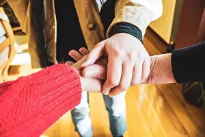 Baby Boomer Prints: clasped hands of united family