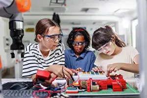 Students Prints: Classmates working togeter on circuit board