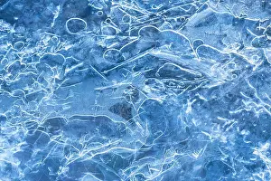 Frozen Prints: Clear blue ice in river