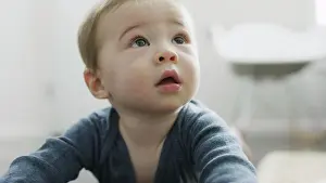 Curiosity Prints: Close up of adorable inquisitive baby boy looking up