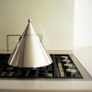 Appliance Prints: Close up of Alessi Conico stainless steel tea kettle on hob