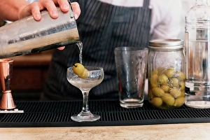 Gifted Prints: Close up of bartender pouring cocktail at cocktail bar
