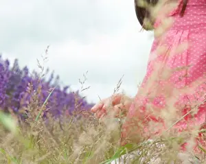 Summers Prints: Close up of girl in field of flowers