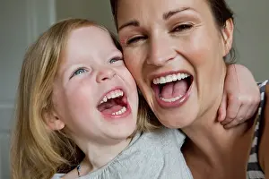 Thirty Prints: Close up of mother and daughter laughing