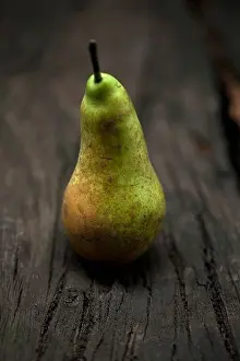 Verticals Prints: Close up of pear on table