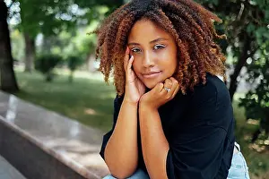 Chic Prints: Close up photo of wavy hairdo charming cheerful dark skin person have good mood nice sightseeing weekend outdoors