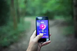 Runner Prints: Close up POV runner using health app on smart phone screen