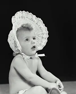Bonnet Prints: Close-up of a baby girl wearing a bonnet