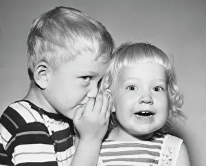 4 5 Years Prints: Close-up of a boy whispering to his sister
