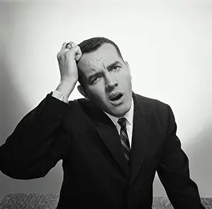 Business Suit Prints: Close-up of a businessman looking confused