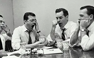 Beverage Prints: Close-up of four businessmen yawning
