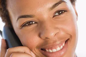 On The Phone Prints: Close-up of a businesswoman talking on a cordless phone and smiling