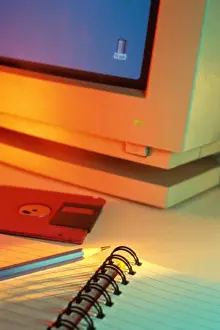 Spiral Prints: Close-up of a computer monitor near a floppy disk