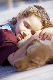 Denim Prints: Close-up of a girl sleeping with her dog