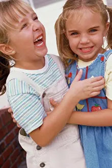 4 5 Years Prints: Close-up of two girls hugging each other