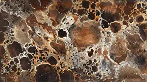 Graphic Prints: A close-up image of an abstract pattern in brown