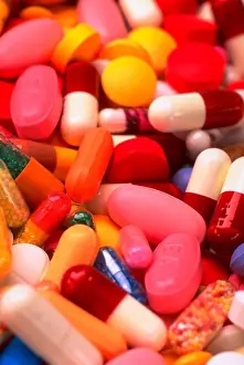 Verticals Prints: Close-up still life of a pile of various pills