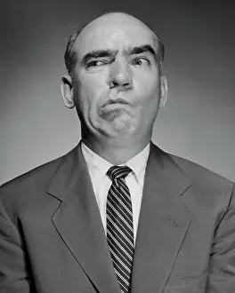 Bald Prints: Close-up of a mature man making a face