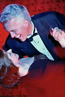 40 45 Prints: Close-up of a mid adult couple dancing