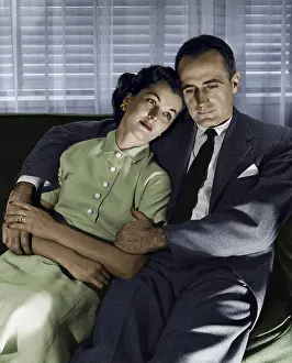 Shirt And Tie Prints: Close-up of mid adult couple sitting on couch