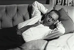 Eyes Prints: Close-up of a mid adult man sleeping on a couch