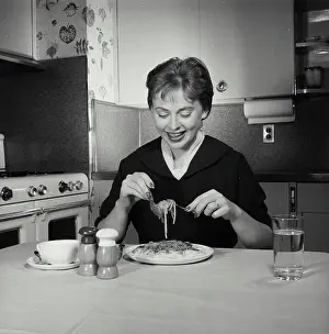 Pasta Prints: Close-up of a mid adult woman eating pasta