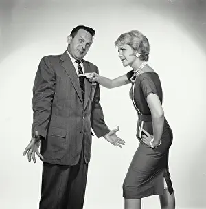 Shirt And Tie Prints: Close-up of a mid adult woman scolding at a mid adult man