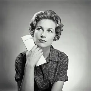 Pondering Prints: Close-up of a mid adult woman thinking