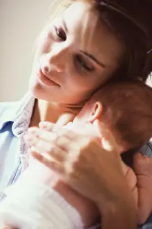 Life Events Prints: Close-up of a mother carrying her baby boy